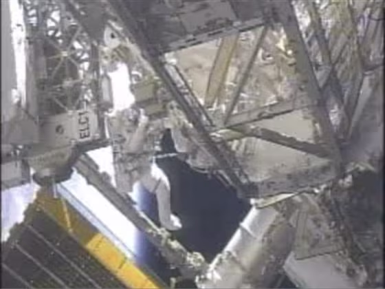 Endeavour astronaut Andrew Feustel works on the exterior of the International Space Station during Friday's spacewalk, which was cut short due to a spacesuit sensor failure.